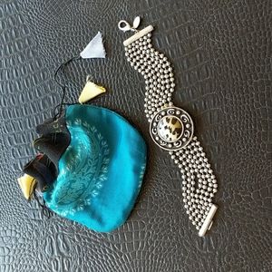 Bracelet. Chico's brand, 7 inch with animal print design and product storage bag